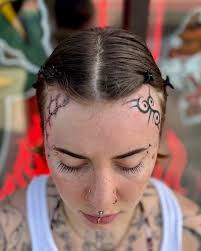 Image result for quirky pylon forehead tattoo