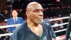 Entrance by 58 years old Mike Tyson using a towel