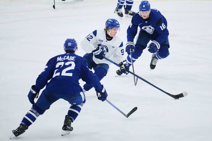 Gavin McKenna shines in Toronto Maple Leafs debut with Tavares and Nylander  | AP News