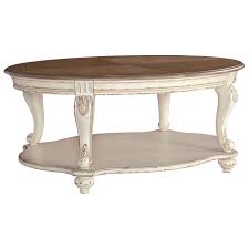 Here's a truly ornate table, features an intricately designed. Signature Design By Ashley Realyn Two Tone Oval Cocktail Table With Bottom Shelf Royal Furniture Cocktail Coffee Tables