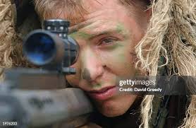 Sgt. Corbin Robinson of Groveland, MA looks through a .50 caliber... News  Photo