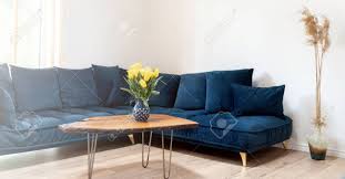 Amazing gallery of interior design and decorating ideas of navy coffee table in living rooms, decks/patios, pools, girl's rooms, dining rooms by elite interior designers. Stylish Boho Living Room Interior With Design Navy Blue Sofa Wooden Handmade Coffee Table Cozy Apartment Home Decor Stock Photo Picture And Royalty Free Image Image 147551826