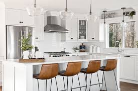 White shiplap, painted cabinets, and open shelves infuse the kitchen with farmhouse flair. Long Island Open Concept Kitchen Remodeling Open Concept Designs