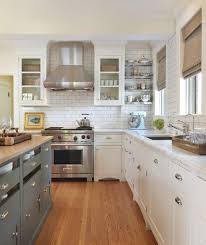 Beautiful Classic Two Tone Kitchen With White Glass Front Kitchen Cabinets With Marble Countertops Subway Tiles Backsplash Blue Timeless Kitchen Kitchen Design Kitchen Remodel