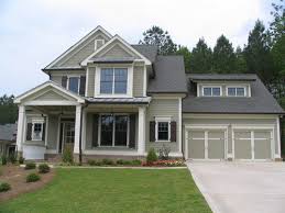 1970s two story grey house with cream shutters garage landscaped lawn suburban residential. Exterior Color With Shutters
