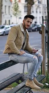 Their straightforward and clean design means that they can complement a range of outfits without clashing or seeming uncoordinated. Youclement With A Fall Combo Idea With A Tan Corduroy Shearling Lined Jacket Gray Striped Sweat Boots Outfit Men Winter Outfits Men Chelsea Boots Men Outfit