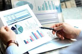 Business Man Working And Analyzing Financial Figures On A Graphs On A Laptop Out Affiliate Working Analyzing Bu In 2020 Financial Analyst Financial Internship