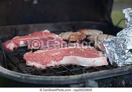 As with the skirt steak, flank steak needs to be grilled quickly over very high heat and sliced against the grain. T Bone Steaks On Charcoal Grill T Bone Steaks Sit Sooking With Other Foods On A Charcoal Grill Canstock