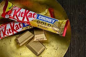 The sayings on the kit kat bars in a scene in office. Nestle Launches A New Kitkat Chunky Gold Krisp Chocolate Bar Daily Mail Online