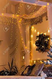A single string of lights can change the look of your cozy bedroom and make it more beautiful. White Cozy Bed And Christmas Lights Stock Photo Picture And Royalty Free Image Image 112698422