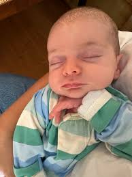 1 month with Izzy Evelyn. Her favorite hobbies are sleep squawking, gettin  strolled in her stroller, and causing mastitis. For me, it wasn't instant  overwhelming love at first sight like you're supposed