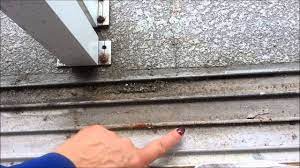To realign your door in the tracks at the top and bottom of the frame, remove the door from the track and reinsert it. How To Clean Your Sliding Glass Door Track Youtube