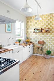 A black accent wall finished in textured wallpaper serves as a contrasting background to a pristine white bed with an upholstered headboard. Kitchen Wallpaper Accent Wall 1920x2889 Wallpaper Teahub Io