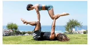 This advanced pose improves lower body strength for the base person, while opening up. Simple Acro Yoga Simpleacroyoga Fl May Blog Kohayoga Elliptical 700x3651 Gif 700 365 In 2021 Partner Yoga Poses Two People Yoga Poses Couples Yoga Poses