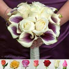 There's an effortlessness to their grace, a simple bouquet made of purple and white, but still quite dramatic. Purple Calla Lilies And White Roses Wedding Bouquet For The Bride Or Maid Of Honor