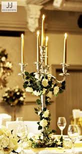 Click to see more gorgeous white color wedding ideas; Pin By Timeless Weddings Company On Candelabra Table Settings Candelabra Wedding Centerpieces Candelabra Wedding Candleabra Wedding Centerpieces