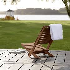 Strike up a cozy conversation on a porch swing or gently sway in a swinging chair while reading a good book. High Low The Folding Wood Beach Chair Remodelista Folding Beach Chair Beach Chairs Sand Chair