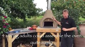 The components of the outdoor pizza oven came from a kit. The Easy To Assemble Small Onion Shaped Bushman Wood Fired Oven On A Rustic Stand Youtube