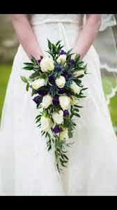 Wedding bouquets for the bride and bridesmaids are decisions you need to make based on type of flower bouquets you want, arrangements and cost. Beautiful Waterfall Scottish Wedding Bouquet Wedding Flowers Scottish Wedding Wedding Bouquets
