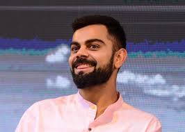 Same as in this picture he has adopted. Kohli Beard Fade Novocom Top