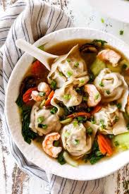 Up Close Of Easy Wonton Soup Recipe In A White Bowl Wonton Soup Recipe Wonton Soup War Wonton Soup Recipe