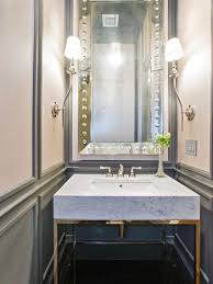 A bathroom doesn't have to be big to have great style and function. Counter Stone Gold Brass Fixtures Stylish Bathroom Bathroom Design Modern Bathroom Design