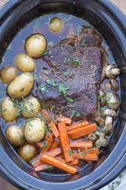 An Easy Pot Roast Recipe In A Slow Cooker With Carrots Potatoes And Mushrooms Family Dinner Ready Pot Roast Slow Cooker Pot Roast Recipes Slow Cooker Roast
