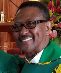 Monsignor Jno Lewis describes the late Dr. Alwin Bully as a "great man"