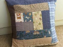This is a square shaped cushion. Tiny Happy Log Cabinish