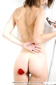 Angelita nude bending over a chair