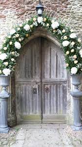 Arch Over The Church Door Inc White Hydrangea Gypsophila Peach Roses Church Wedding Decorations Wedding Arch Church Flowers