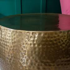 Convenient yet distinctive, this drum adds a gentle gleam and versatile function to any home or office. Hammered Brass Drum Coffee Table Audenza