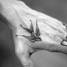 Bird Tattoo On Hand For Boys Top 73 Traditional Swallow Tattoo Ideas 2020 Inspiration Guide Traditional Hand Tattoo Bird Tattoo Men Hand Tattoos