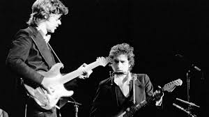 The chief songwriter and lead guitarist of the band, who later moved into film (acting, producing, scoring) and a solo career. Robbie Robertson While Playing With Bob Dylan I Remember Thinking They Re Going To Wake Me Up Tomorrow Because All Of This Is Impossible Guitar World