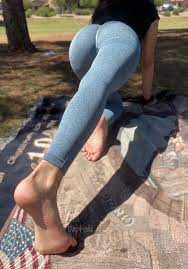 Flexed Soles while doing some Stretching outside - FeetPlaza