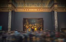 Children look at rembrandt's famed night watch, which is back on display in what researchers say in its original size, with missing parts temporarily restored in an exhibition aided by artificial intelligence. Het Verhaal Achter Het Meesterwerk De Nachtwacht