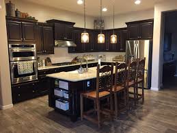Espresso Cabinets With Matching Island White Subway Tile Backsplash Pendant Lighting Espresso Cabinets Espresso Kitchen Cabinets White Subway Tile Backsplash