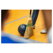 In Matt Dilley's Grade 9 Physics class, students participated in a bowling  ball and broom relay race yesterday. Using broom bristles, they guided a  bowling ball across the floor of their Annex
