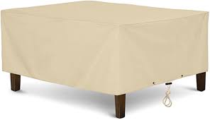 Our khaki outdoor round coffee table cover is constructed of tightly woven polyester and backed with polyvinyl chloride to protect against damage from rain and snow. Amazon Com Sunpatio Outdoor Ottoman Cover Heavy Duty Waterproof Rectangular Coffee Table Cover Patio Furniture Side Table Cover All Weather Protection 40 L X 30 W X 18 H Beige Kitchen Dining