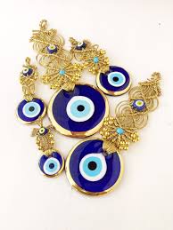 Evil Eye Wall Hanging Gold Macrame Wall Hanging Gold Evil Eye Bead Evil Eye Home Decor Blue Glass Evil Eye Greek Evil In 2020 Handmade Evil Eye Evil Eye Eye Decor