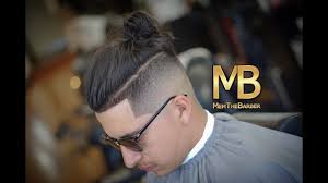 The man bun fade is a prevalent option, as it's basically an undercut which fades from short to long at the sides and back, but leaves a considerable amount of length on top to complete the man bun. Mid Fade Man Bun Tutorial Youtube