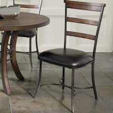 There should be enough room so that when chairs are pulled away from the table, they still have their back legs on it. Hillsdale Cameron 5pc Round Metal Ring Dining Room Set W Ladder Back Dining Chairs In Chestnut Brown By Dining Rooms Outlet