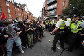 Demonstrators detained by police during rival protests outside asylum hotel  | Ealing Times