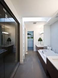 Above it is a framed piece of art with a welcoming message. 26 Narrow Bathroom Ideas That Are Trending In 2021