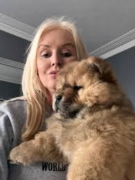 So my female chow who is 2 years old she stands at 20 inches tall she  currently weighs 31.2kg.. is she overweight?? She's walked 3 times a day  sometimes 4, she plays