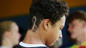 Classmates, coaches get haircuts to show solidarity with teen who has bone  cancer