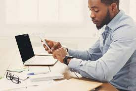 Young Black Businessman With Smartwatch In Office Young Black Business Man Young Black Professional
