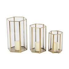 Decorative candle holders are excellent for enhancing the ambiance of any dining room. Set Of 3 Modern Metal And Glass Candle Holders With Hexagon Silhouettes Gold Cosmoliving By Cosmopolitan Target