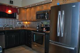 A lot of cabinets are wood and brown, so you'll want pinterest is specifically designed for those seeking inspiration and offers an array of home design images you can pin to your own personal inspiration. 5fca3ba854bf9f6932e7ed99546cb038 Jpg 736 492 Kitchen Tile Backsplash With Oak Black Kitchens Black Stainless Steel Kitchen