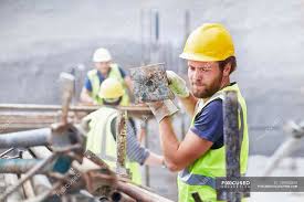 Usa metal art construction set gift model golden gate bridge white house empire. Construction Worker Carrying Metal Bar At Construction Site Looking Down Waist Up Stock Photo 199883808